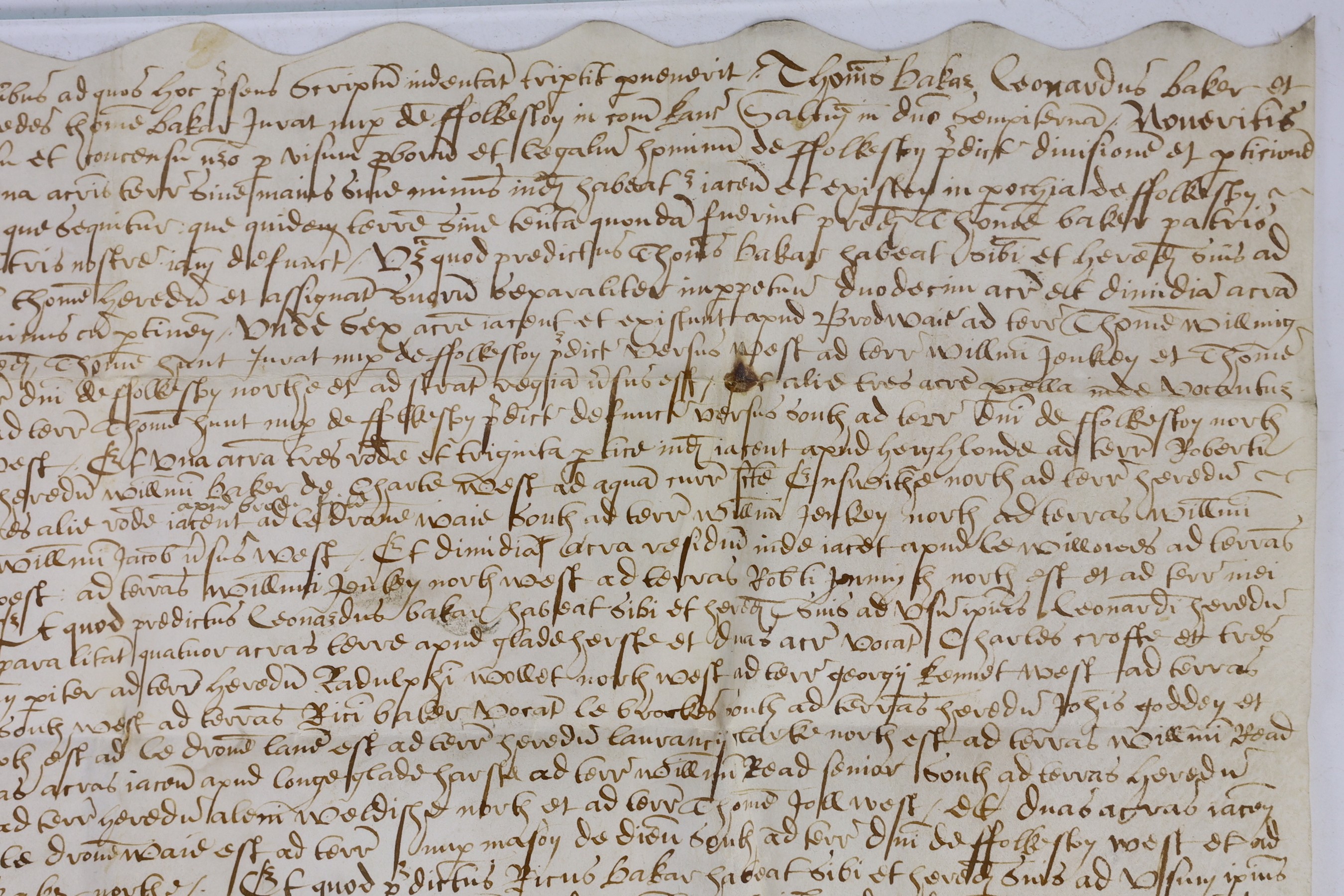 An Elizabethan charter recording the division of property, in Latin, in black ink on vellum, 30 x 37cms.